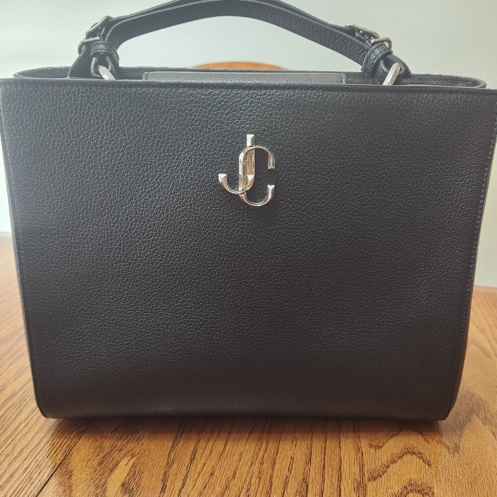 Only used for a few months. Wanted a smaller purse